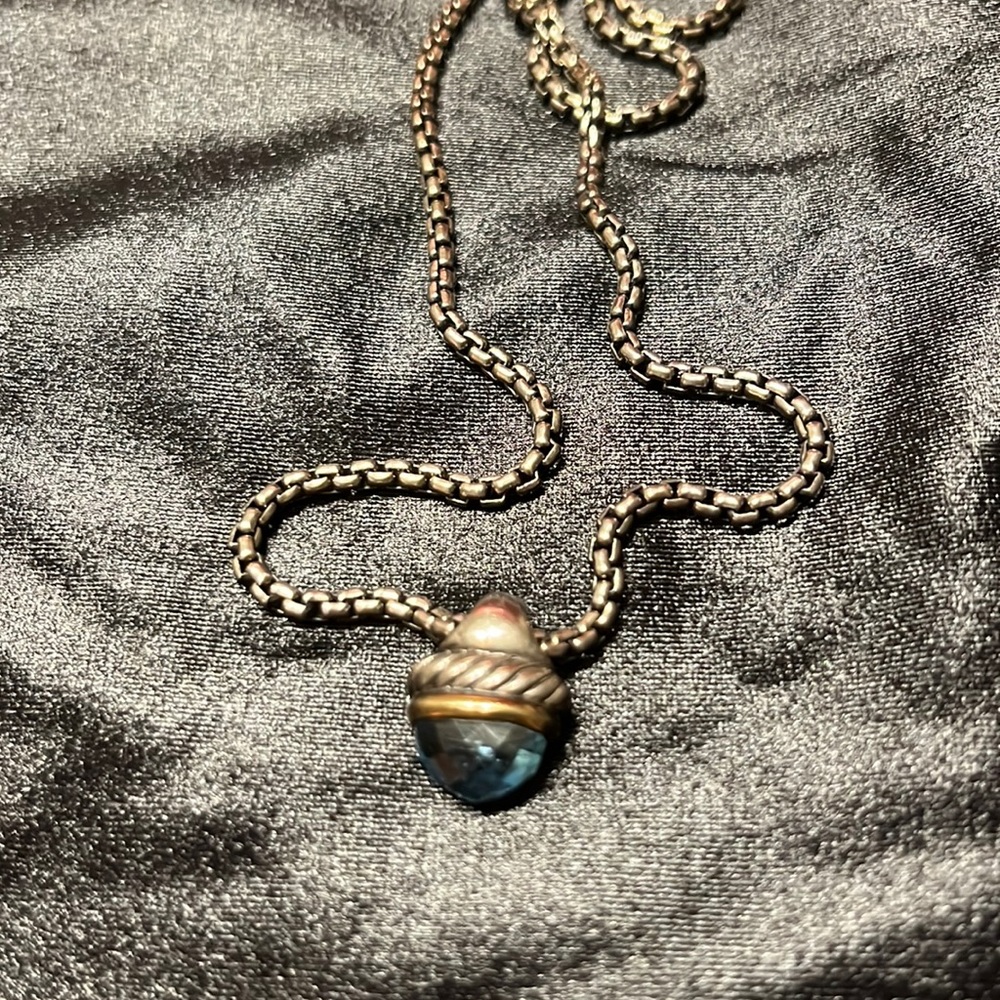 Original David Yurman blue topaz acorn amulet with original chain.